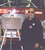  Chuck's father Charlie standing beside plaque presented to E-165 & L-85 to honor Chuck.