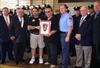  Here I am with my father and Capt. Bob Sohmer accepting a plaque presented in Chuck's Honor.  John Solazzo (2nd from left), and Tim Rice (far right), presented the plaque to E-165 & L-85.