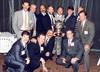  Chuck left of trophy on knee, with members of the Championship team at reunion 1996.