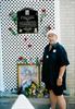  Chuck's dad Charlie, along side the garden dedication plaque and portrait of Chuck.