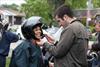  Norma Margiotta getting some help with her helmet.