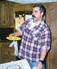  Stuffing a piece of pizza in his face in mom's basement.