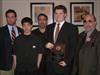  Sean Moore (holding Plaque), was the winner of the 3rd Annual Chuck Margiotta Memorial Award.  Sean played Defensive Tackle for the Monsignor Farrell Lions.  He is pictured here flanked by (left to right), Chuck's nephew, son, brother and father.