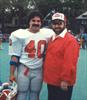  Chuck wearing his firehouse number, with his father Charlie.