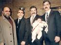 Left to right: Chuck's dad, Chuck's father-in-law, Chuck holding son Charlie, and Lt. Paul Mitchell, Chuck's lifelong friend, also lost in the WTC on 9/11/01