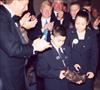  Chuck's son & daughter being presented with the Borwn University Sports Hall of Fame Induction trophy.  November 2001